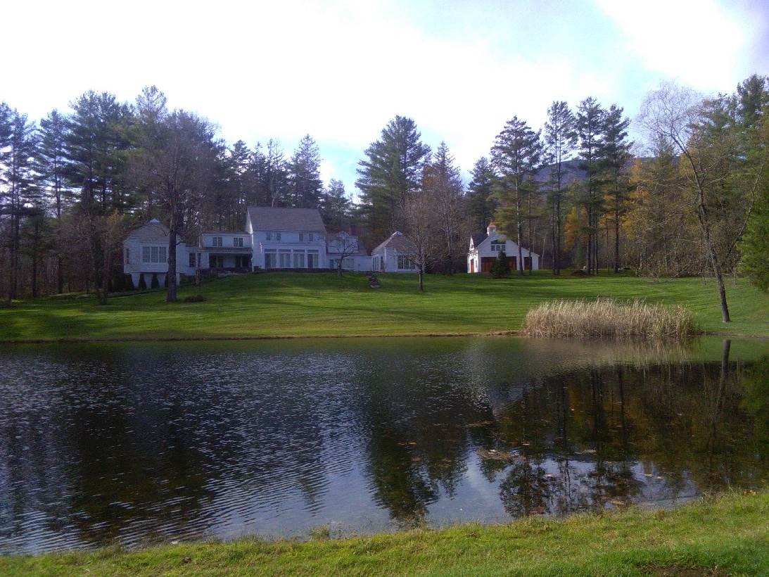 Picturesque pond in front of our clients home and thriving green lawn